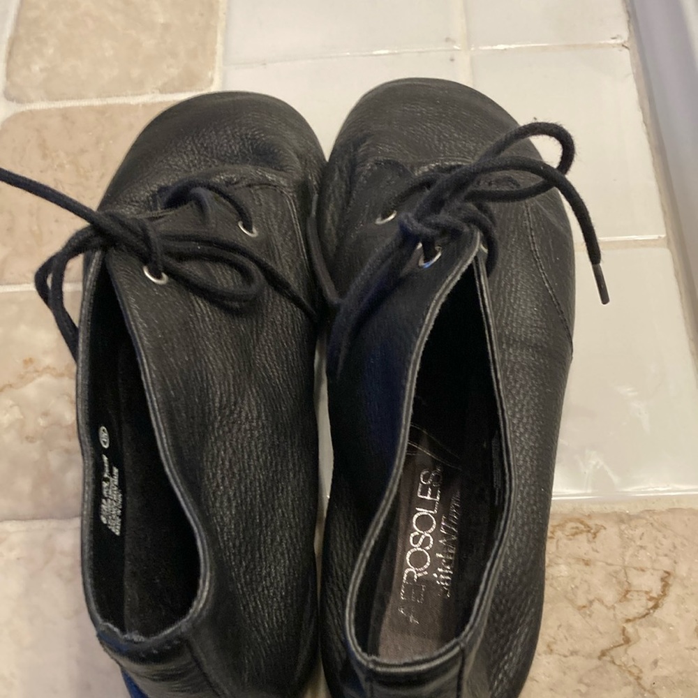 Aerosols, black leather booty